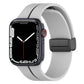 Two-color silicone watch band with folding buckle, light gray and black.