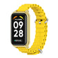 Metal shell silicone watch band in yellow with silver clasp and perforated links