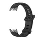 Black breathable silicone watch band with perforations and metal-toned clasp