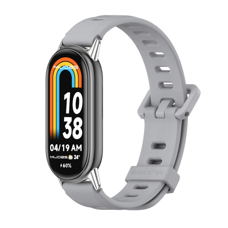 Grey breathable silicone watch band with perforations and metal-toned buckle