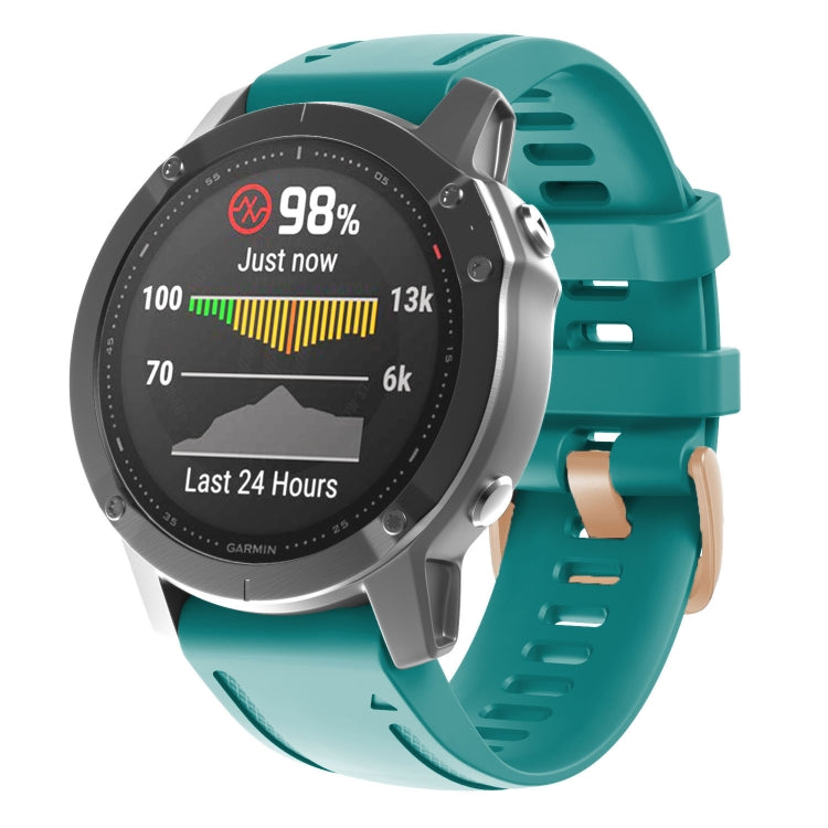 Teal silicone watch band with rose-gold buckle and adjustable holes