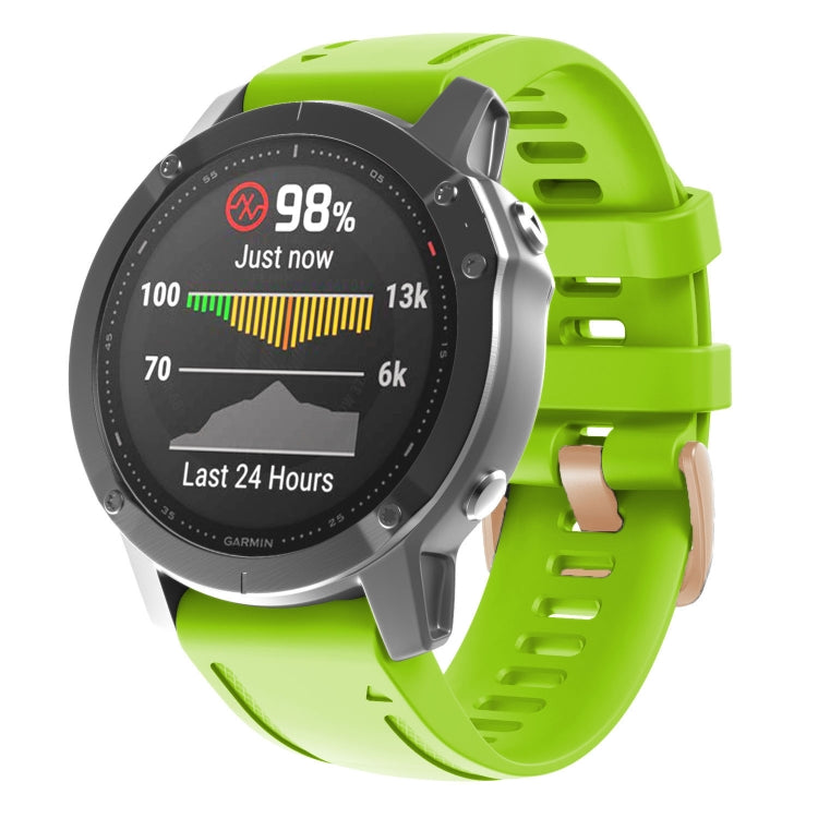 Bright lime green silicone watch band with rose-gold buckle and adjustable holes