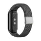 Grey braided nylon watch band with adjustable steel buckle and silver clasp