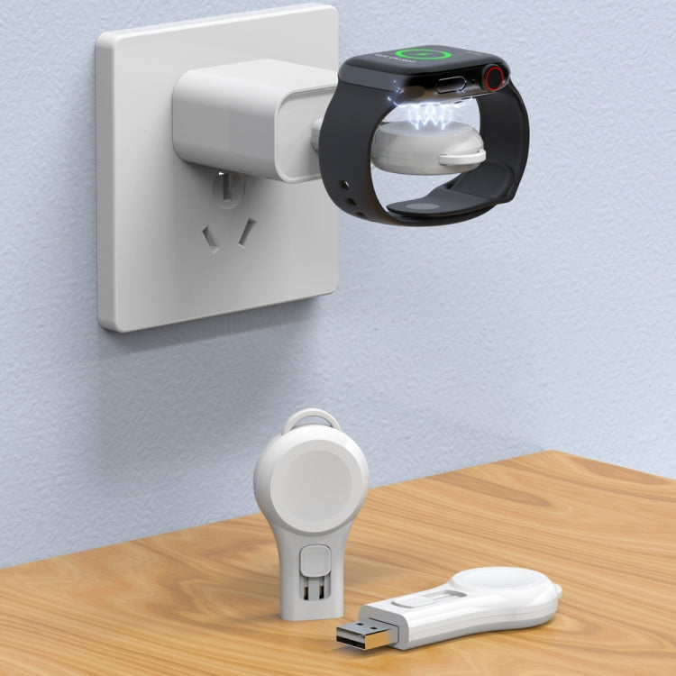 White magnetic suction wireless charger on wall outlet with USB connector