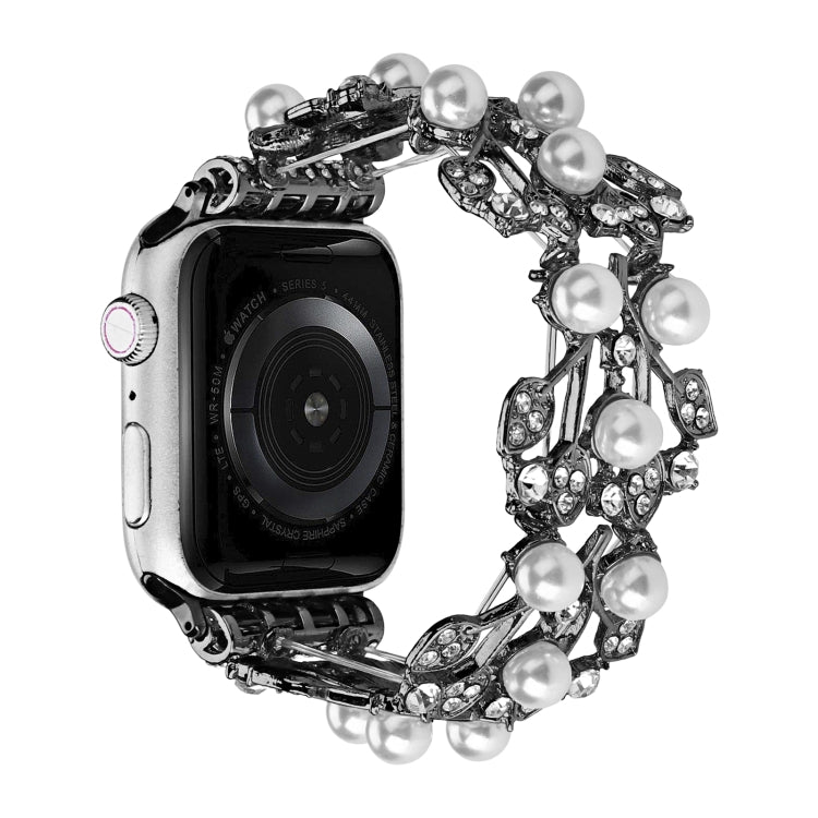 Silver metal watch band with four-leaf bead links and round pearl-style stones