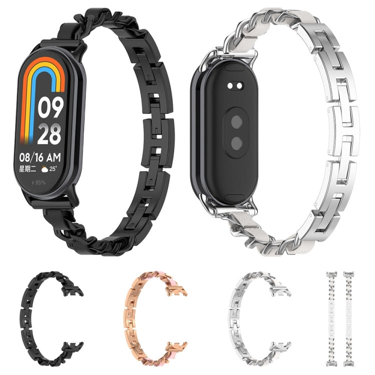 Assorted link replacement watch bands with fitness trackers: black, rose gold, and silver