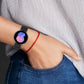 Black silicone watch band with dot-texture strap and multiple pin holes on wrist
