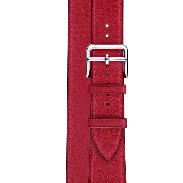 Red leather watch strap buckle with stitched edges and multiple adjustment holes