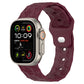 Wine red football-texture silicone watch band with textured pattern and clasp connector.