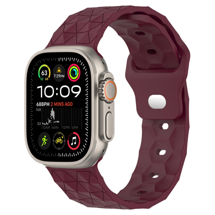 Wine red football-texture silicone watch band with textured pattern and clasp connector.