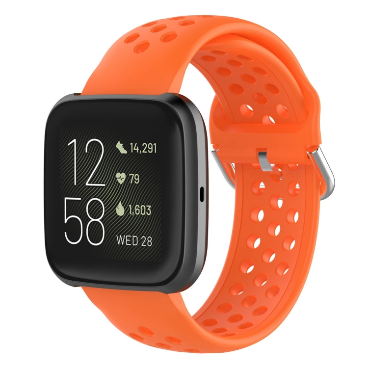 Orange silicone sport wrist strap with perforations and metal pin buckle