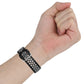 Silicone sports watch strap, black with white perforated dots on wrist