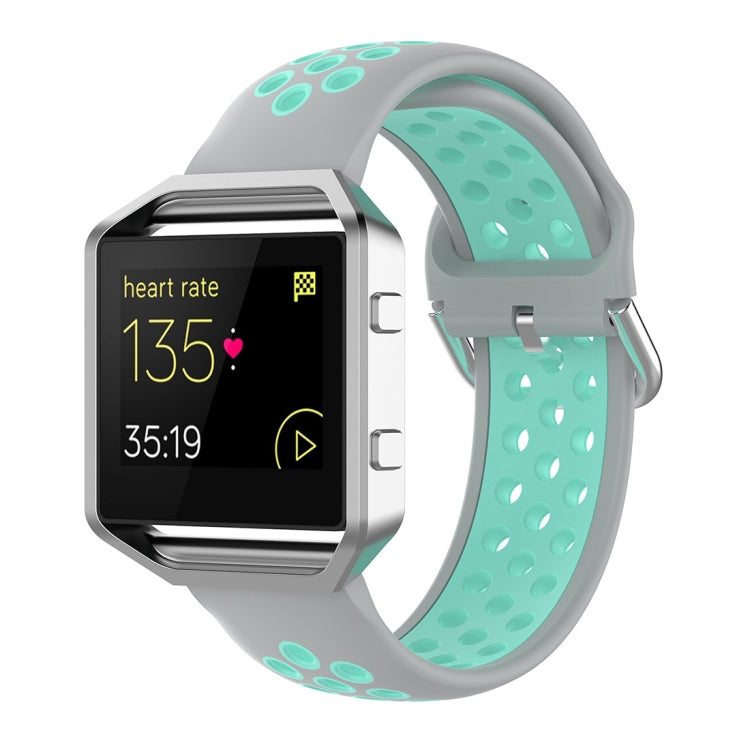 Fitbit silicone watch strap with light gray base and light teal accents, perforated design