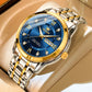Two-tone stainless watch with blue dial and gold bezel, close-up angled view