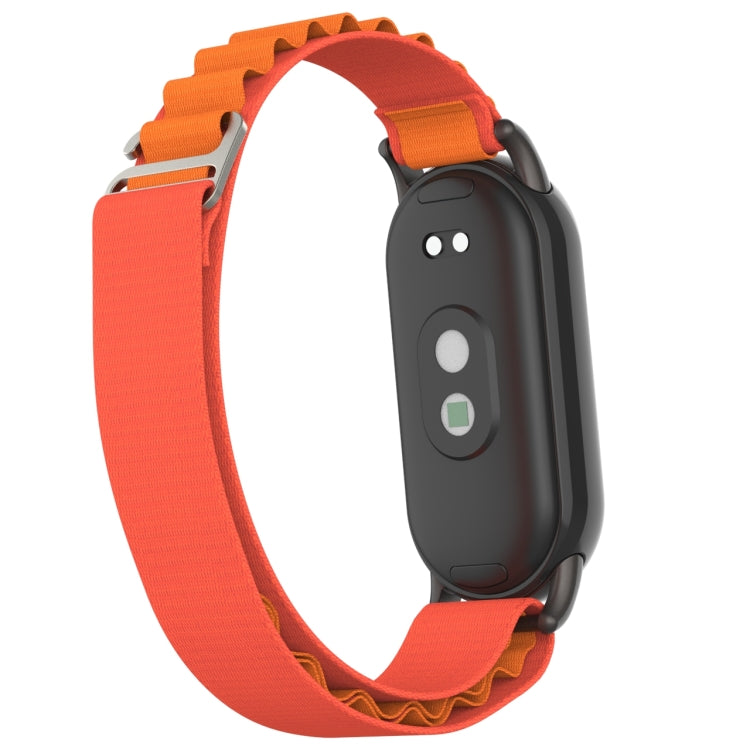 Metal plug loop nylon watch band with orange strap and black back-facing watch