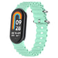 Mint green silicone watch band with perforated links and metal clasp for tracker
