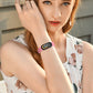 Pink silicone watch band on wrist with fitness smartwatch face visible