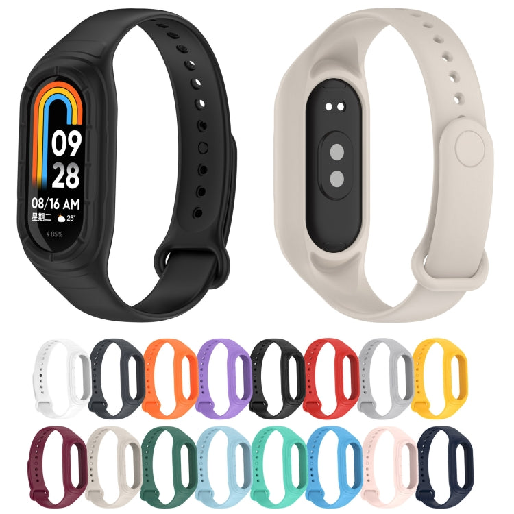 Black and cream silicone watch bands shown with fitness tracker displays
