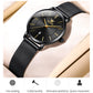Black dial quartz watch with black mesh steel strap, minimal gold-style markers