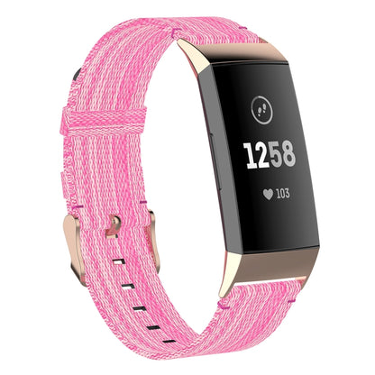 Pink nylon watch strap with stitched perforations and metal clasp for Fitbit Charge 4/3 SE