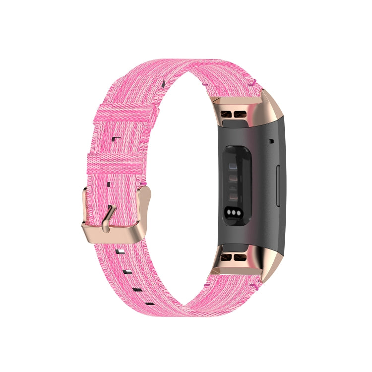 Pink nylon watch strap with metal clasp and perforation row, shown looped