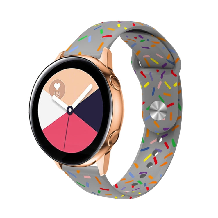 White silicone watch band with colorful oval dot sprinkles pattern, reverse buckle closure.