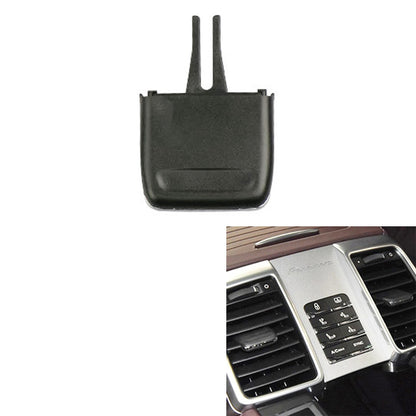 Black AC air vent paddle with two mounting prongs and a rectangular front cover