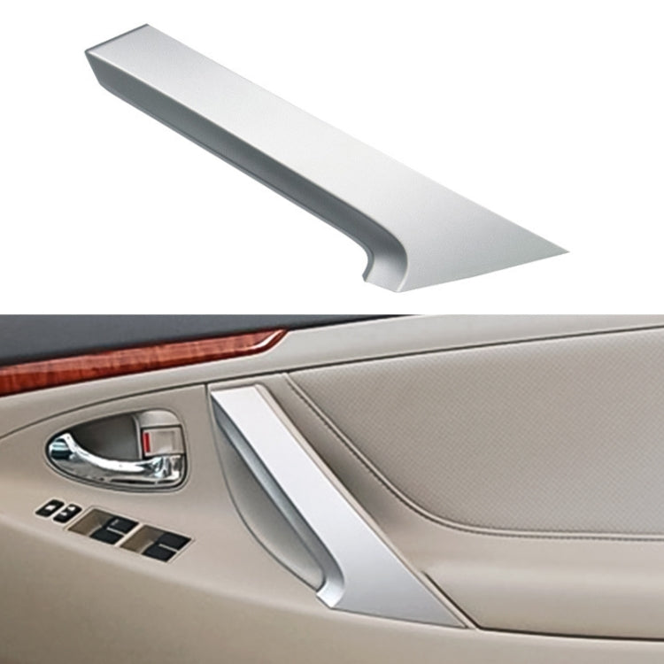 Silver interior door handle cover for Toyota Camry, installed on door panel