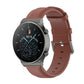 Round tail leather watch band with buckle, brown strap with adjustment holes.