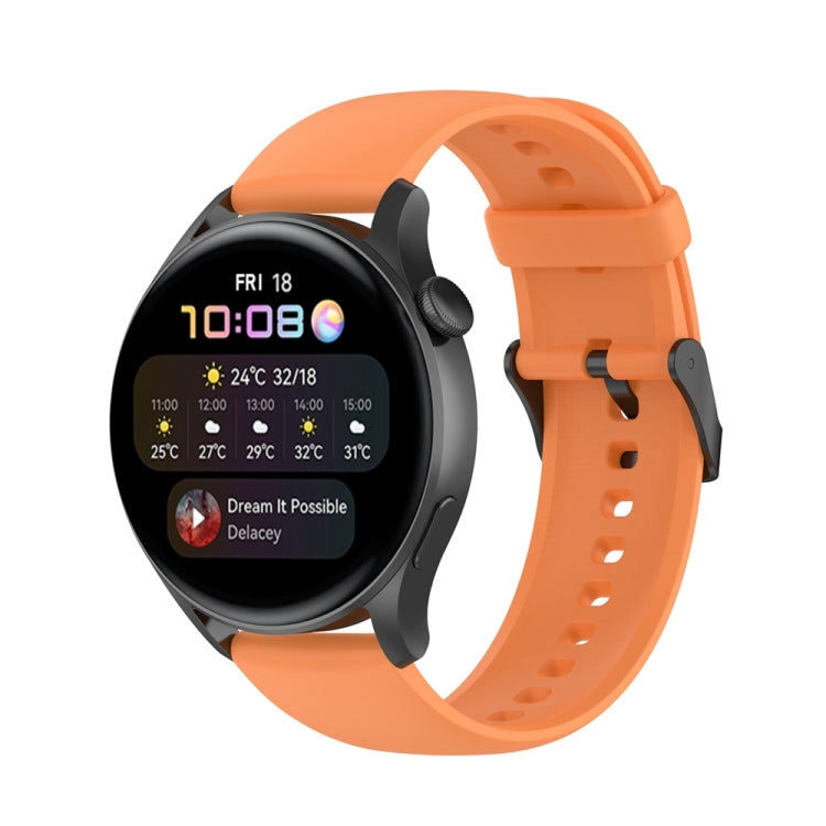 Orange silicone watch band with stainless steel buckle and perforated strap holes