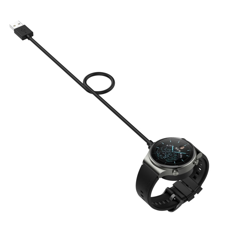 Black magnetic charging cable with USB-A plug connected to a smartwatch