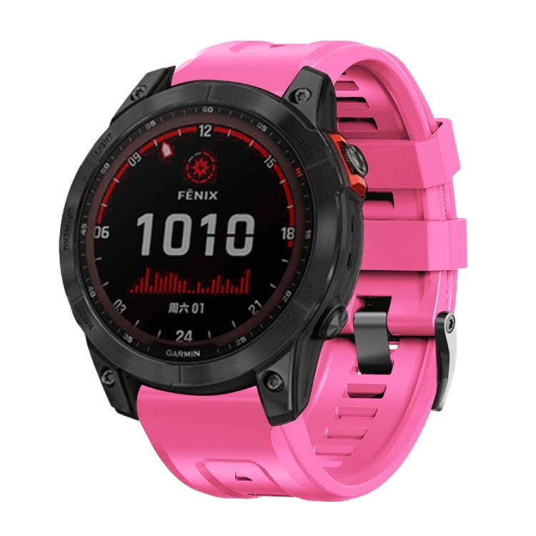 Pink silicone smartwatch band with metal buckle, front view on sport watch