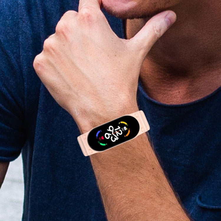 Pink integrated TPU watch band worn on wrist, fully enclosed strap
