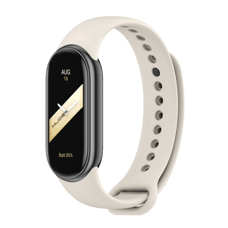 Light white silicone smartwatch band with black fitness tracker face and side buttons