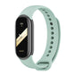 Silicone watch band with perforated strap holes, light green color, for fitness tracker