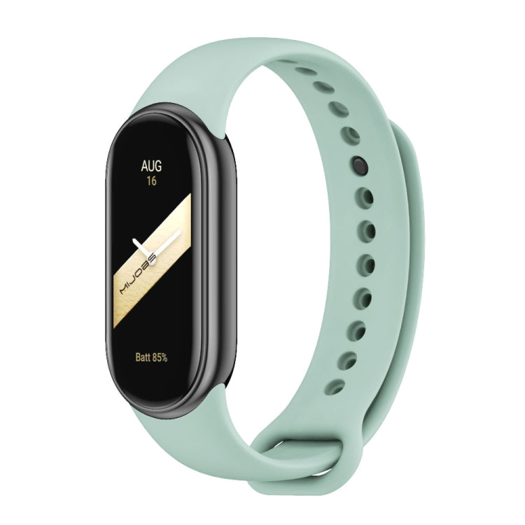 Silicone watch band with perforated strap holes, light green color, for fitness tracker