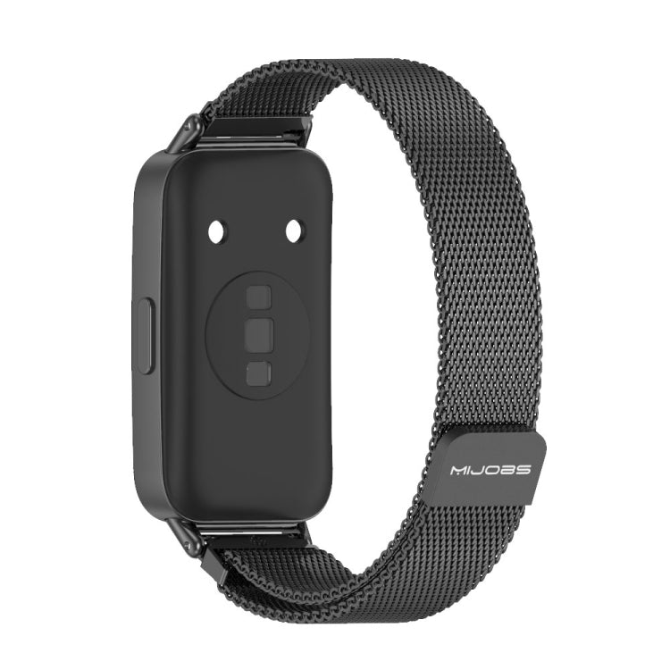 Black mesh magnetic watch band with metal clasp, shown with tracker backing