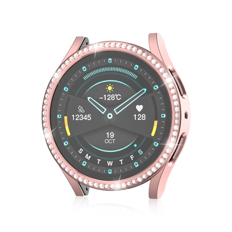 Diamond hollow watch protective case, pink tone with rhinestone bezel, open-face view