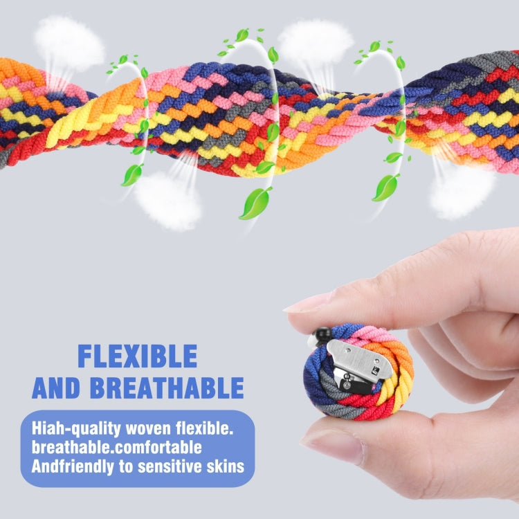 Multicolor braided nylon watch band with silver metal buckle clasp, held by hand.