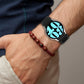 Leather silicone watch band on wrist in black with metal buckle and perforated strap