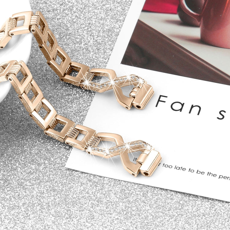 Rose gold watch band with sparkling rhinestone cross links, accessory close-up