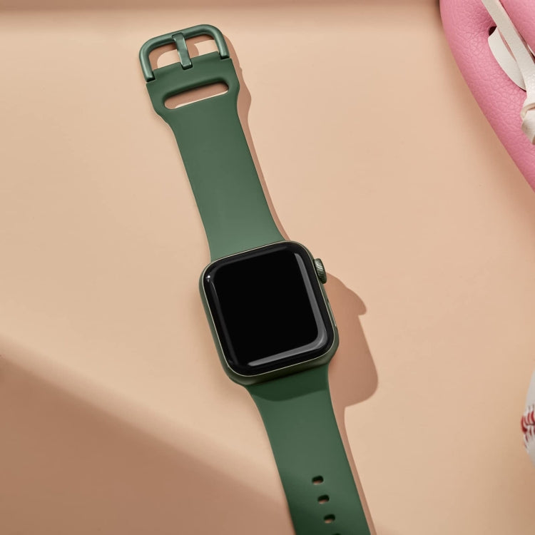 Clover green silicone watch band with pin buckle, worn on wrist, Apple Watch 38mm