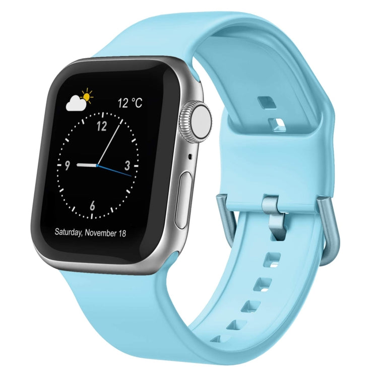 Light blue silicone Apple Watch pin buckle band with perforated strap and clasp.