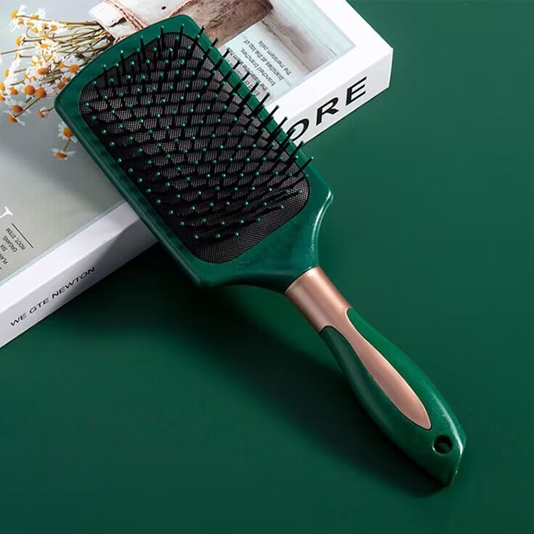 Teal hair massage brush with black pin bristles and vented cushion base