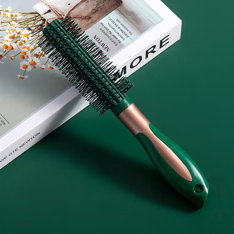 Curly hair massage brush with teal base, black bristles, and copper-toned handle