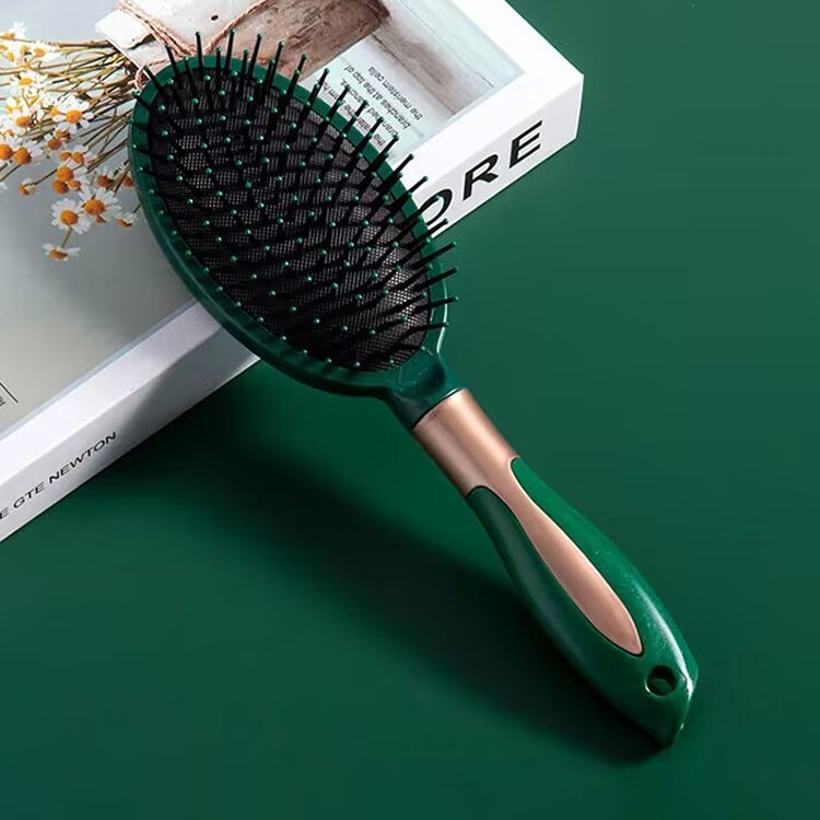 Curly hair massage hairbrush with teal base, black pins, and ergonomic handle
