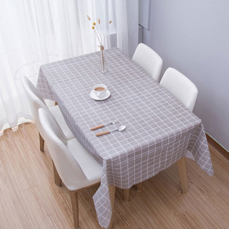 Grey plaid PVC tablecloth with grid print, dining table set with cup and utensils