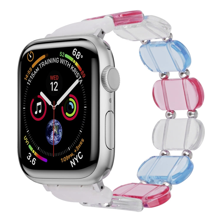 Stretch resin watch band with transparent blue and pink chunky links and metal pins