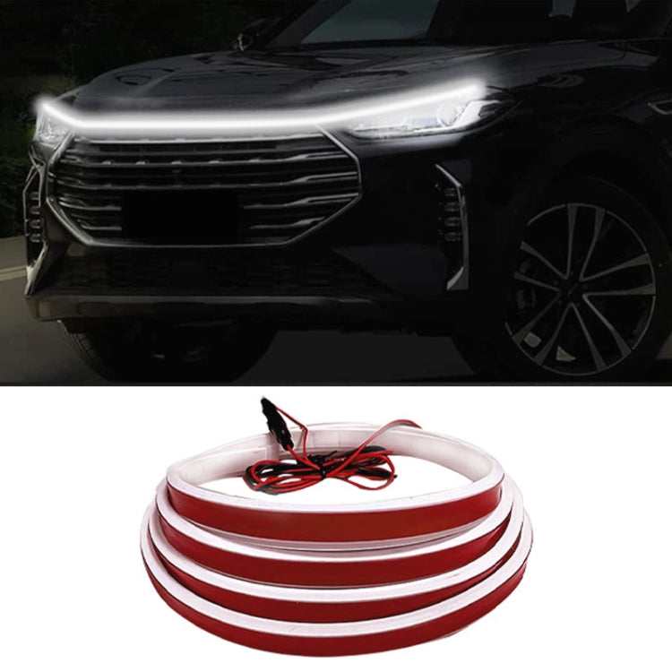 LED hood light strips with white scan-through running light effect on a car front