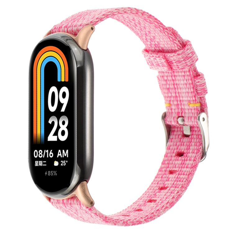 Pink nylon canvas watch band with metal buckle and adjustable strap holes